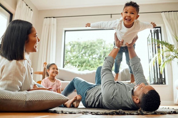 The father with kids in living room at Columbus, OH